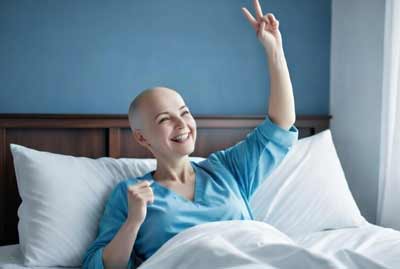 Woman celebrating recovery during breast cancer after care journey
