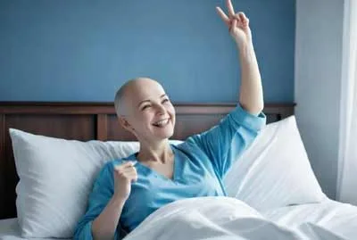 Woman celebrating recovery during breast cancer after care journey